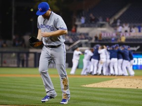 Adam Lind walks off the field after the Blue Jays lost 4-3 to the San Diego Padres in 17 innings on Friday night. (Reuters)