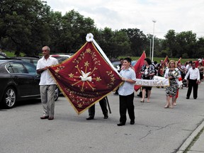 About 450 people from Brantford and surrounding areas were at the civic centre on Sunday for the Portuguese Holy Spirit Festival. The event included a mass, a procession and several traditional meals. (MICHELLE RUBY, The Expositor)