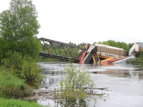 Emergency officials were on scene of a train derailment on Highway 537 in Wanup, just south of Sudbury Ontario on Sunday June 2/2013. A train trestle over the Wahnapitae River collapsed and a number of train cars fall into the river.

GINO DONATO/THE SUDBURY STAR/QMI AGENCY