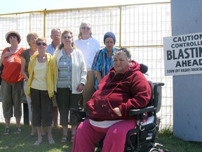 Residents of The Royal Canadian Legion Villa on Princess Street are concerned about the blasting at a construction site next to them. Front (from left): Barb Clarke, Darlene Lightfoot, Bonnie Martelle and Bev Lennox Rear (from left): Nancy Hart, Anne Laverty, Al Ward and Dave Rowell. (Alison Shouldice For The Whig-Standard)