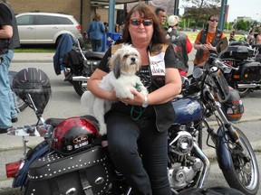 Margaret Donnan and two-year-old dog, Chance, get ready on Saturday. Chance was aboard Donnan's Harley for the 70-kilometre ride. (MICHELLE RUBY, The Expositor