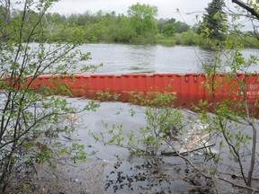 One of the containers from one of the cars on the train ended up about one kilometre from the the wreckage down the river.