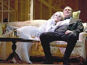 Michelle Giroux, as Elvira, and Ben Carlson, as Charles, are shown in a scene from Noel Coward's Blithe Spirit.