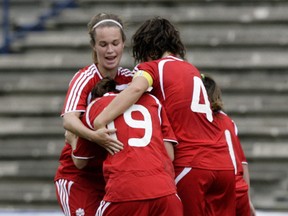 Canada's striker Karla Schacher (19) celebrates with teammates after scoring against U.S. in the final match of the FIFA U-20 Women's World Cup soccer qualification at the Cuauhtemoc stadium in Puebla City, Mexico, in 2008. (QMI AGENCY/File)