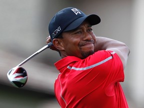 Tiger Woods watches his tee shot on the 10th hole during the final round of the Memorial Tournament at Muirfield Village Golf Club in Dublin, Ohio, June 2, 2013.  (REUTERS/Matt Sullivan)
