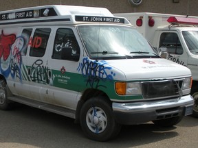 A police photo of an ambulance spray painted with graffiti in Fort McMurray. (RCMP Photo)