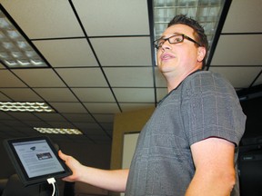 Northern Lights School Division’s Information Systems Analyst Matt Stavert demonstrates the new NLSD-2-GO app during the May 29  board meeting.