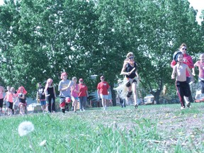 About 50 runners hit the track for the first Nanton Tennis and Athletic Society relay race June 1, 2013.