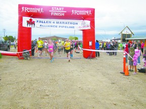 The first set of runners in the Fallen 4 Marathon burst through the starting gate at the Fallen Four Memorial Park in Mayerthorpe at 7 a.m. on Sunday, June 2.