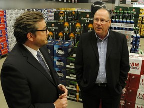 Brewers Retail Inc. president Ted Moroz takes Brantford Mayor Chris Friel on a tour of the new Beer Store at 50 Market St. S. on June 3, 2013. The store features the more modern walk-through format. (HUGO RODRIGUES Brantford Expsoitor)