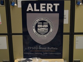 Wood Buffalo Combined Forces Special Enforcement Unit seized one litre of GBH, approximately $36,000 in cocaine and several thousand in Canadian and US currency from a Fort McMurray apartment complex. Photo: ALERT drugs