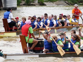 A pair of dragon boats row to the finish line during the Sydenham Challenge Dragon Boat festival held on Saturday