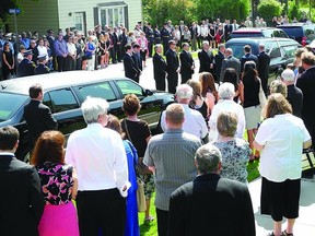 Hundreds gathered in Gananoque last Friday to mourn the death of Richard Gordon Robinson of the Ontario Provincial Police. Robinson, 46, died suddenly of natural causes on May 24.          Wayne Lowrie - Gananoque Reporter