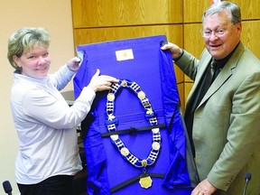 Deputy Mayor Heidi Conarroe and Mayor Frank Kinsella display the chain of office for a former township that will be recycled for the TLTI.