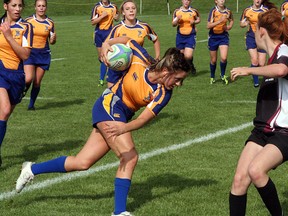 Bev Facey’s Nicole Tkchanko barrels into the Bulldogs during Thursday’s 43-12 Metro League Premier Conference championship win over Bellerose. Tkchanko had four tries for the Falcons in the victory. Photo by Shane Jones/Sherwood Park News/QMI Agency