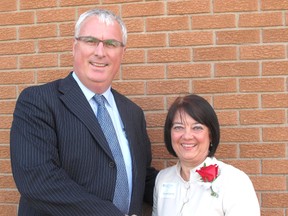 Denise Emery, pictured here with Lambton Kent District School Board director of education Jim Costello, was one of the 68 retirees honoured Monday, June 3, 2013, during the board's annual Employee Retirement and 25 years of Service Recognition Evening, held in Dresden, Ont. Emery, who worked up the ranks from an education assistant to special education co-ordinator with LKDSB, is retiring after 33 years.

ELLWOOD SHREVE/ THE CHATHAM DAILY NEWS/ QMI AGENCY