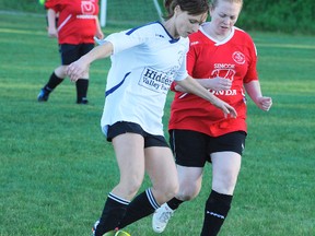 DANIEL R. PEARCE Simcoe Reformer

Natasha Martin (left) of the Hidden Valley team and Lauren Andres of Simcoe Honda battle for the ball in women's recreational soccer league action at the Simcoe soccer complex on West Street Monday night. Hidden Valley won the game 4-3.