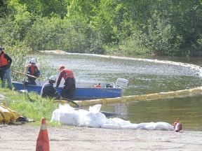 In this file photo, crews work at the Wahnapitae River to prevent environmental damage from oil spills following a train derailment in Wanup in 2013. About a gallon of diesel spilled near the river on Friday.
GINO DONATO/THE SUDBURY STAR/QMI AGENCY