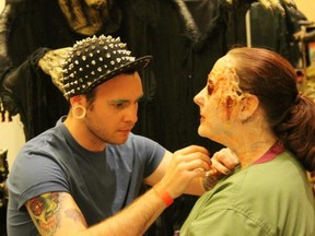 Lanny Brown works on his winning special effects makeup look at Crypticon Seattle. Brown is a professional makeup and special effects artists who just finished working on his first feature film. (Submitted photo)