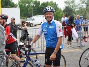 Roger Menard poses with his bicycle during the Ride for Heart on the Don Valley Parkway in Toronto last Sunday. Menard cycled 75 kilometres. On Jan. 10, he was playing hockey at Memorial Gardens when he went into cardiac arrest. His teammates performed CPR and used an automated external defibrillator (AED) to save his life.
