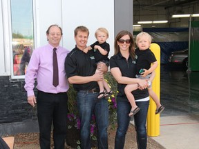 Melfort Mayor Rick Lang (left) spoke at the grand opening of the new Spiffy Car Wash in Melfort on Saturday, June 1. He was joined by owners Ron and Jocelyn Ferguson. Hundreds of people took advantage of the free burgers and wand washes at the facility during the grand opening.