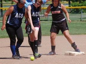 North Park's Taylor Greenwood is safe at second base as a pair of Assumption players react to the call Tuesday during the Brant County high school girls fastball championship. (DARRYL G. SMART, The Expositor)