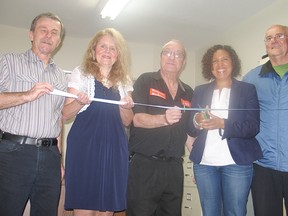 The Missing Children and Adults Association has found a home at 31 Second St. East. Cutting the ribbon at their grand opening this week was director Mike Vernier, vice-president Jocelyne Tremblay, president Jean Bedard, Coun. Bernadette Clement and Bernard Rozon of the Richelieu Club.
Staff photo/CHERYL BRINK