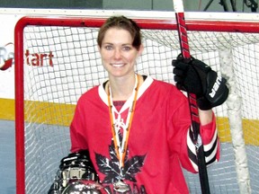 Mallory Johnston of Chatham poses with the second-place trophy at the 2011 International Street and Ball Hockey Federation championship in Bratislava, Slovakia. (Contributed Photo)