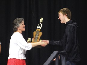 Ben Campbell receives the George W. Mead Trophy for his work in Beaver Brae’s musical theatre scene from teacher Suzanne McIntosh.
ALAN S. HALE/Daily Miner and News