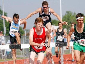 Bayside Red Devils' Adam Doxtator competes in the open men's 2,000m steeplechase race at the East Regional Track and Field championships last Friday at Belleville's M.A. Sills Park.