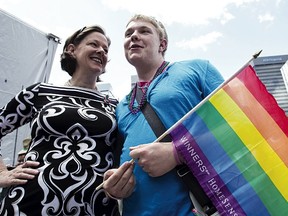 Premier Alison Redford and Matt Schmitt chat after the 2012 Stand Out Pride Parade. This year’s parade starts at noon Saturday on 107 Street and 102 Avenue, and will make its way down 102 Avenue to Churchill Square. File Photo/QMI Agency