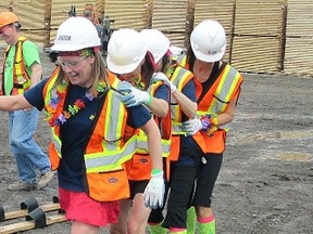 Ten teams completed a course that included many fun challenges. Here they are at Spray Lake Sawmills try some old-fashioned smooshing.