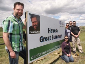 Declared town council candidate Dan Cunin, left, was joined by some of his volunteers to put of the first sign for this fall’s municipal election, May 26. Lending a hand were Rebecca Davidson, seat, Najwa Zahr, Tim Giese and Randy Zahr.