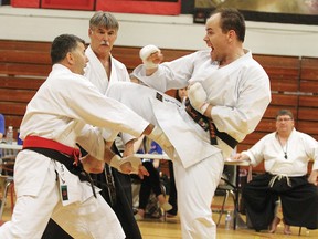 Mike Zinck, left, and John Staples square off in the men’s kumite final at the JKA Canada National Championships in Saskatoon June 1. Zinck would go on to win the match.