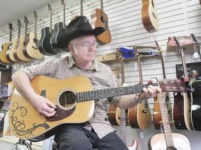 Thane Hughes plays a little ditty in his shop in Wetaskiwin May 30. Thane’s Music Stop is celebrating its 10 year anniversary this week.