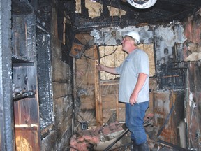 Ken Parks of Onside Restoration inspects the damage in a West Lorne home where a fire started last week.