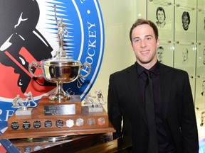 Outgoing Sarnia Sting captain Charlie Sarault accepts the Leo Lalonde Memorial Trophy as the OHL's top overage player during the OHL award ceremony Tuesday at the Hockey Hall of Fame in Toronto. AARON BELL/OHL IMAGES