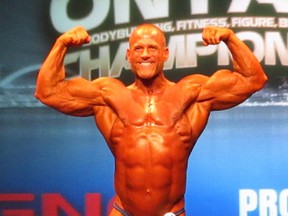 Corunna native Tim Love poses for the crowd after winning the heavyweight bodybuilding division of the Ontario Physique Association's provincial championships, Saturday in Toronto. SUBMITTED PHOTO/THE OBSERVER/QMI AGENCY