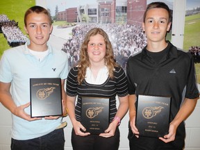 SARAH DOKTOR Simcoe Reformer
Holy Trinity honoured its top athletes at its annual athletic banquet on Wednesday. Josh Johnson (left) was named top senior male athlete, Katelyn Heyens (centre) was named top senior female athlete and Braden Ongena was named top junior male athlete. Filipa Leitao (not pictured) was named top junior female athlete.