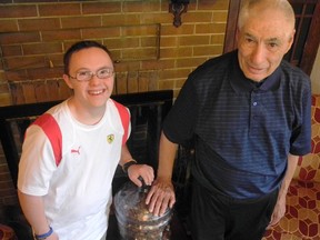 Billy Robbins (right) has been picking up discarded pennies for years in and around Brantford's downtown. He has given them all to Nathan Purdy, who's aiming to collect a million "Pennies for Freedom" to support groups that help those affected by human trafficking.(Hugo Rodrigues, The Expositor)