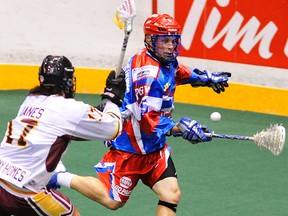 Peterborough Lakers’ Brad Self, right, is pressured by Brampton Excelsiors’ Spencer Janes during Major Series Lacrosse action on May 23 at the Memorial Centre in Peterborough. The Lakers and Kitchener-Waterloo Kodiaks will play an MSL regular-season game at the Rogers K-Rock Centre on Saturday night. (Cliff Skarstedt/QMI Agency)