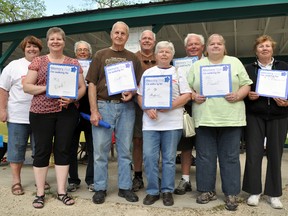 Relatives of Jake Loeppky, front row, second from left, came from British Columbia and Ontario to support the Alzheimer's Memory Walk in Portage la Prairie's Island Park Wednesday evening. Pictured are: front row, from left, Barb Congram, next to her father Jake, his wife Helga Loeppky, and her sister Gisela Cheyne from Winnipeg; back row, Karen Lambert of the Alzheimer Society, Loeppky's sister and brother-in-law Harald and Sandi Kubert from Prince George, and brother and sister-in-law Ed and Diane Kubert from Kitchener. Stay tuned for further details on the Memory Walk at portagedaillygraphic.com. (CLARISE KLASSEN/PORTAGE DAILY GRAPHIC/QMI AGENCY)