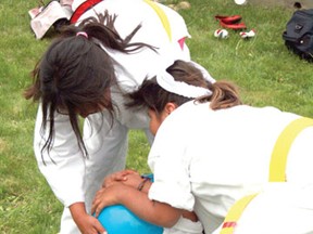 Marlis Ilott, centre, laughs as karate teammates Kitana Blackhawk, left, and Tessa McDonald, right, try to wrestle a giant blue ball away from her during the season-end celebration on Tuesday, June 4. Kenora’s Can-Te IsshinRyu Karate school finished their season with one final tournament on Saturday, June 1.