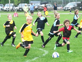 The Drive 4UR Community Event was held on June 1, 2013 at the Davidson Centre. The event saw over 250 test drives taken in vehicles compliments of Montgomery Ford Sales, which resulted in Ford Canada donatinge more than $5000 to the Kincardine District Minor Soccer Club, which hosted soccer games all day at the Davidson Centre for the more than 600 registered soccer players this season. Here, Ben Voskamp of the U10 Subway squad heads into the Boston Pizza end during their game. (JOHN F. ADAMS/KINCARDINE NEWS FREELANCE)