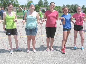 Huron Heights Public School held a Jump Rope for Heart event Friday, May 31, 2013 to raise money for the Heart and Stroke Foundation. Alice Thorpe, Annika VanVeen, Madison Maschke, Rylee Evans and Belle Wilson skip together. (AVERY LAFORTUNE/KINCARDINE NEWS CO-OP)