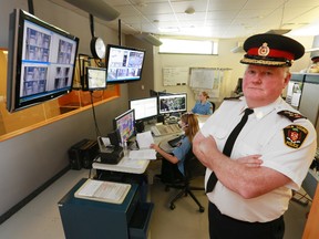 Owen Sound Police Services Chief Bill Sornberger, right, inside the force's police dispatch centre.