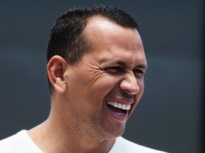 New York Yankees' Alex Rodriguez reacts to a reporter's question after arriving at the Yankees' minor league baseball complex in Tampa, Florida May 6, 2013. (REUTERS)