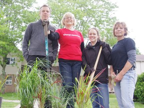 United Way of Day of Caring volunteers planted a garden at Ingamo Homes on Thursday. From left James Vanderloo, Beth Taylor, Amy Skeggs and Christine Broad. HEATHER RIVERS/WOODSTOCK SENTINEL-REVIEW