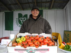 Matt Alenik is bundled up at the Terry-Lin Berry Farm stand on Ninth Street in Cornwall. The farm has some peppers, tomatoes and other produce available, with more on the way as soon as it recovers from the chilly spring.
Kathryn Burnham staff photo