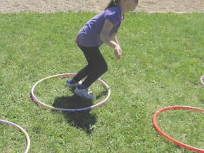 Karmin Barth jumps through hoops.